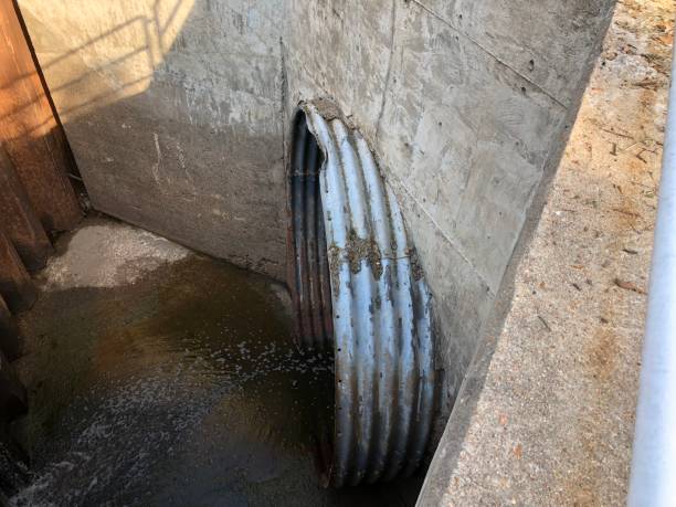 istock Large metal drain pipe - drainage ditch 1153049545