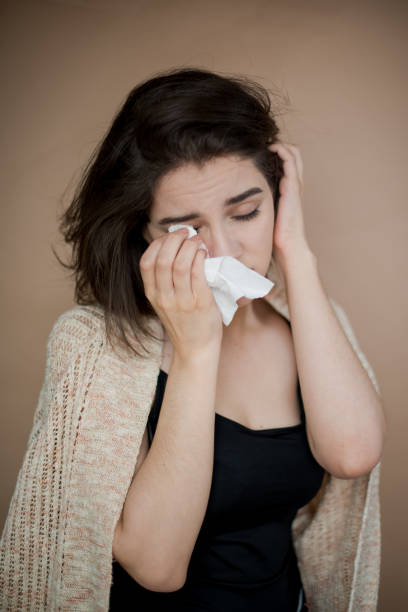 istock Young woman with flu virus symptom. 1153054760