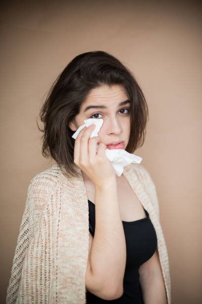 istock Young woman with flu virus symptom. 1153054860