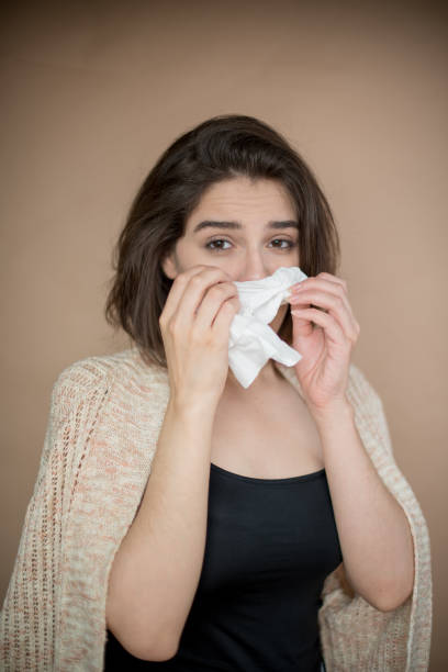 istock Young woman with flu virus symptom. 1153054926