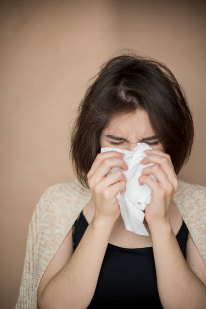 istock Young woman with flu virus symptom. 1153055460