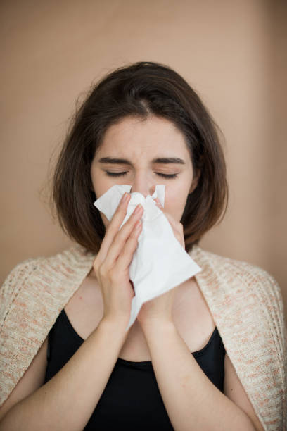 istock Young woman with flu virus symptom. 1153055552