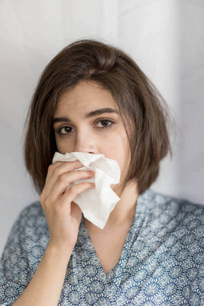 istock Young woman with flu virus symptom. 1153055938