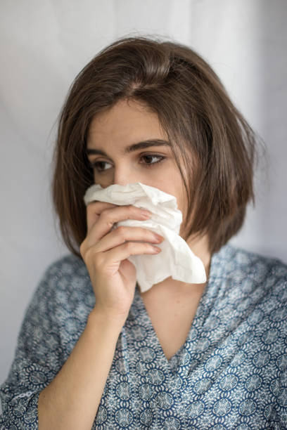 istock Young woman with flu virus symptom. 1153055987