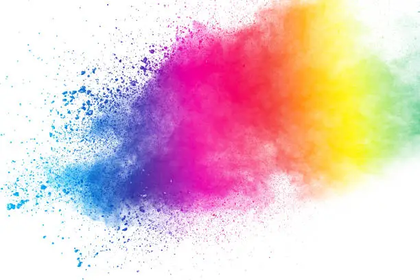 Photo of Colorful background of pastel powder explosion.Color dust splash on white background.