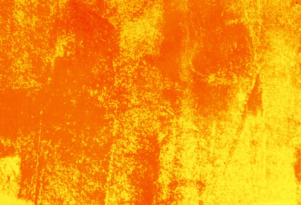 istock Grunge, dirty, unevenly colored orange background. 1153061036