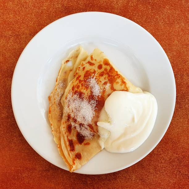 istock Pancake with sugar and cream. 1153061414