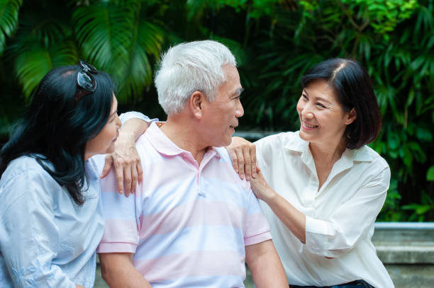 istock Senior adults taking break and having conversation after exercising in park 1153062164