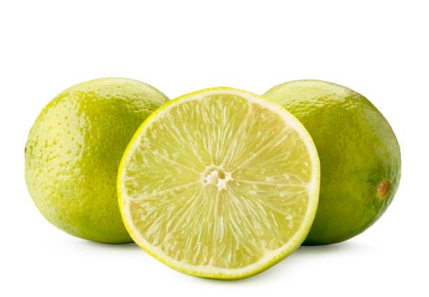 istock Ripe limes and half close-up on a white. Isolated. 1153064538