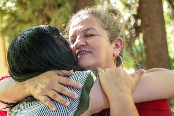 istock Mature woman embracing her daughter 1153070177
