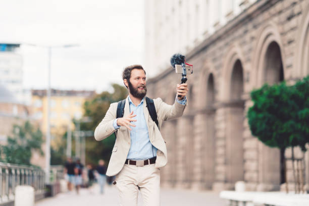 istock Businessman vlogging on business trip 1153074877