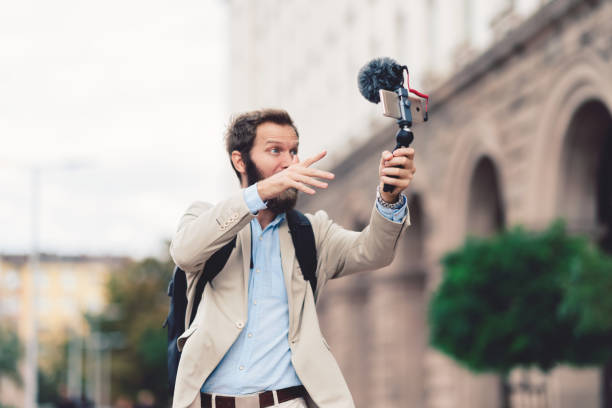 istock Businessman vlogging on business trip 1153074965