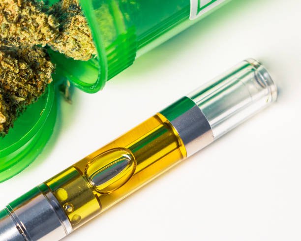 THC:CBD Concentrated Oil Vape Pen & Medical Marijuana Herb Full gram vape pen with medical marijuana up-close isolated on white background. An alternative medicine prescribed to medical marijuana patients. hashish stock pictures, royalty-free photos & images