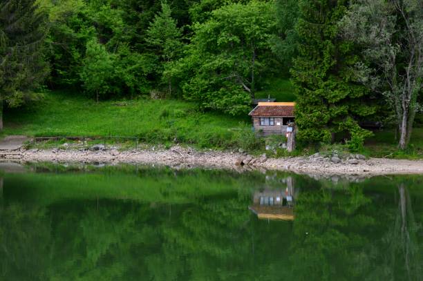 istock reflection of coastline in the lake 1153075220