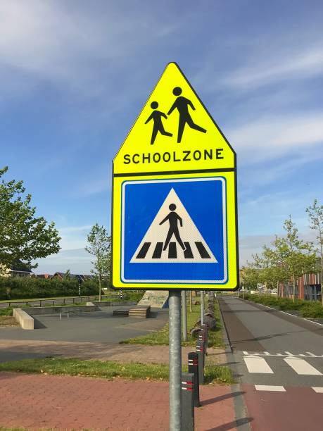 istock Dutch traffic road sign: school zone and crosswalk. 1153077438