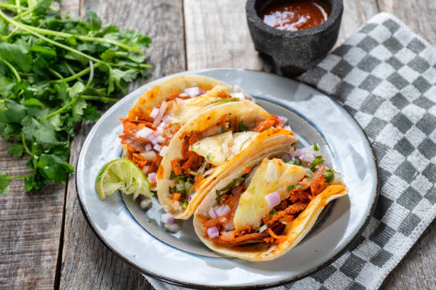 istock Mexican food: Authentic tacos al pastor with lime and pineapple 1153081212