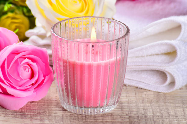 istock Spa composition with candles, flowers on ,wooden background. 1153081465