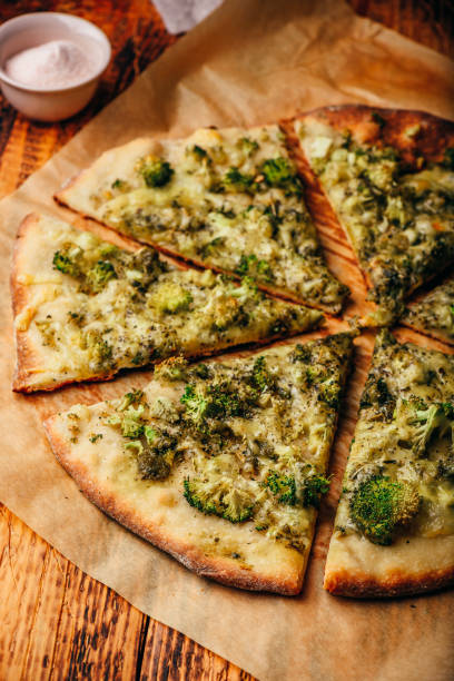 istock Sliced homemade pizza with broccoli and cheese 1153082232