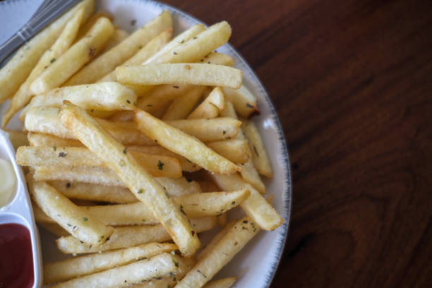 istock French fries food background 1153084815