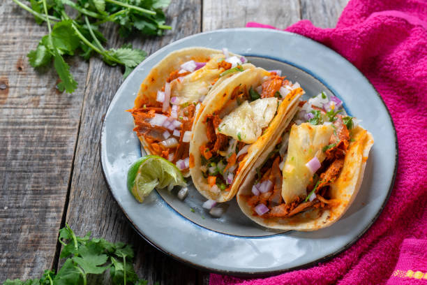 istock Mexican food: Authentic tacos al pastor with lime and pineapple 1153086284
