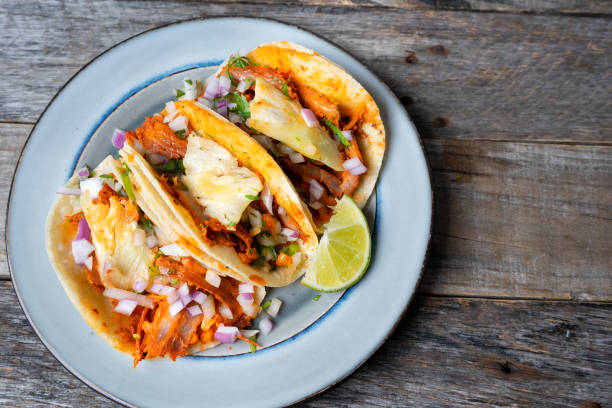 istock Mexican food: Authentic tacos al pastor with lime and pineapple 1153088007