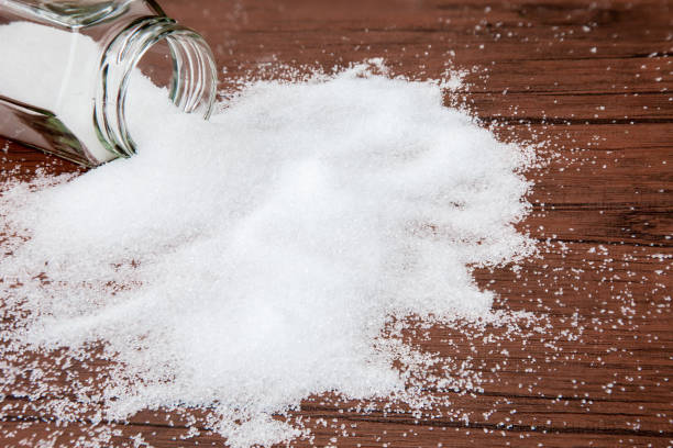 istock white sugar In a jar on wood table with sugar spread . 1153088211
