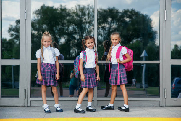 istock Group of kids with backpack going to school together 1153089835