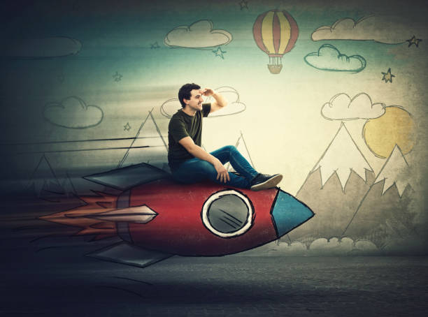 istock Amazed guy flying on a fast rocket looking hand to forehead looking far away for a vacation destination. Excited man searching for summer holiday. Starting new adventure. 1153090993