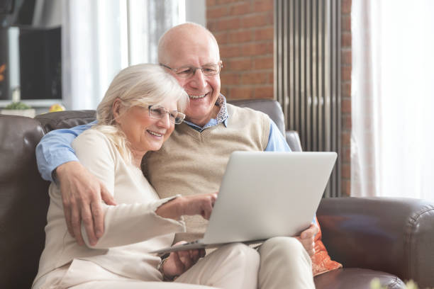 istock Senior couple browsing the internet together 1153091534