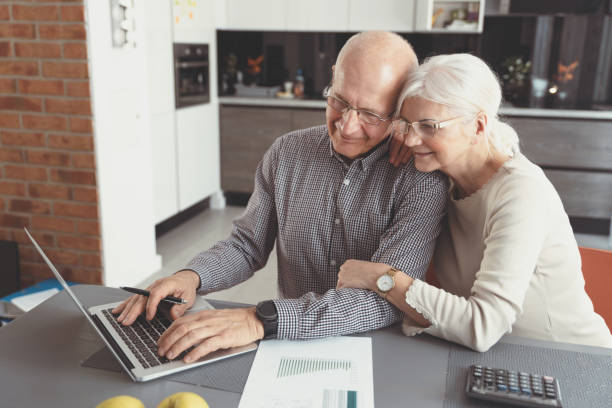 istock Senior couple paying bills together on laptop 1153092133