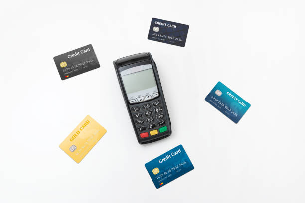 istock Payment terminal with credit cards top view 1153092146