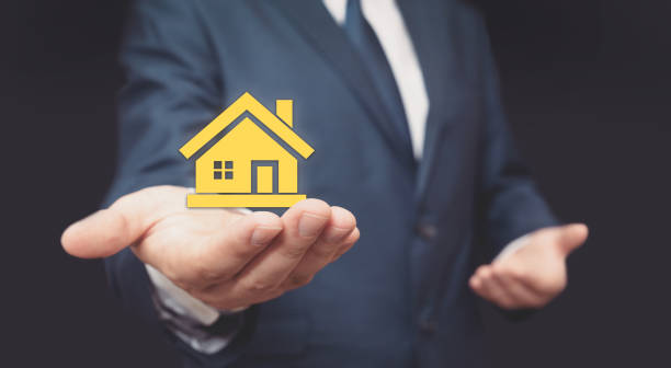 istock Home insurance, real estate agent in suit 1153092173