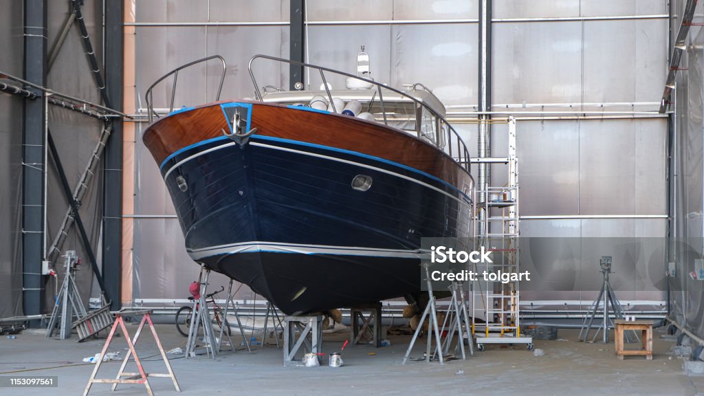 Repair of wooden boats in dry-dock Nautical Vessel Stock Photo