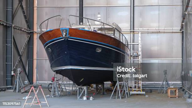 Repair Of Wooden Boats In Drydock Stock Photo - Download Image Now - Nautical Vessel, Repairing, Garage
