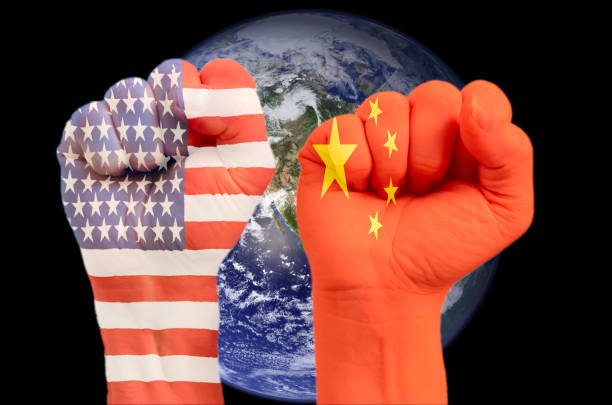 istock Two fists with embedded American and China flag 1153102633