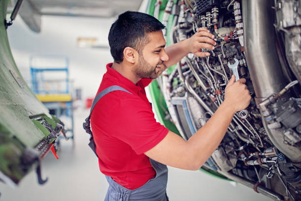 istock Aircraft mechanic is working on the engine in the airplane hangar 1153106561