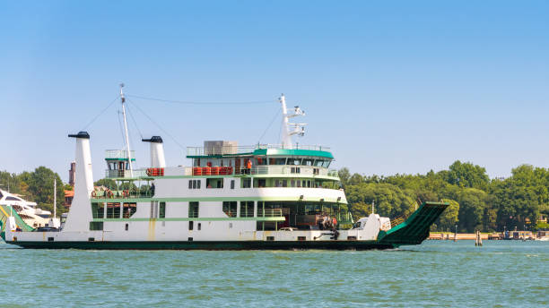 istock Ferry boat sails in Venice, Italy 1153109762