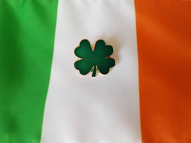 istock Clover enamel pin on Irish flag (centered) 1153111731