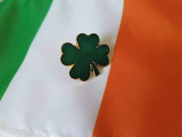 istock Clover enamel pin on Irish flag 1153111758
