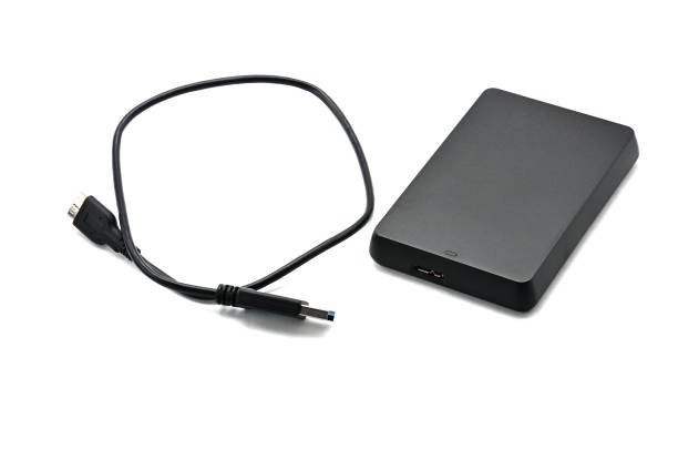istock External hard drive for storing and transferring various files on a white background 1153112562