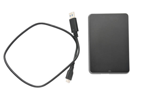 istock External hard drive for storing and transferring various files on a white background 1153112569