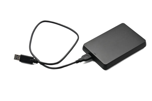 istock External hard drive for storing and transferring various files on a white background 1153112619
