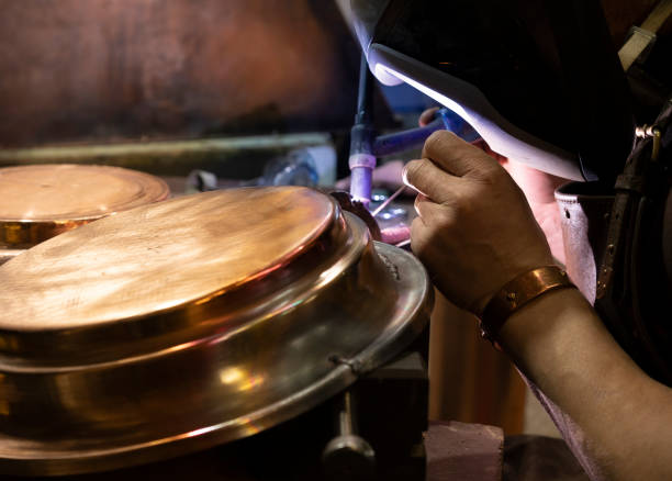 istock The welder working on the brass details with the electrical welding 1153114663