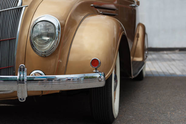istock Shiny golden vintage car front and head lamp 1153114956
