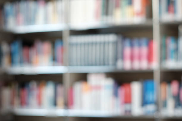 istock Blur image of shelf with books in library. Background. 1153115327