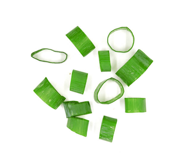 istock green onions (sometimes called shallots or scallions,, isolated on white. 1153118928
