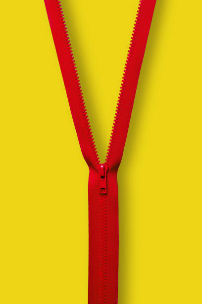 A red zipper on a yellow background representing collaboration.