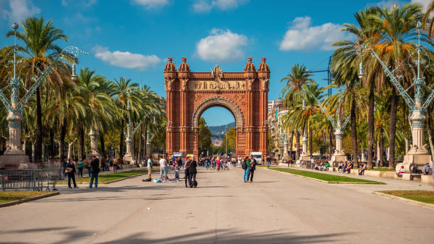 Barcelona, Spain, Arc de Triomf on a Sunny Day Barcelona, Spain - October 23, 2017: Tourists and locals at Arc de Triomf on a sunny day in Barcelona, Catalonia, Spain. arc de triomf barcelona photos stock pictures, royalty-free photos & images
