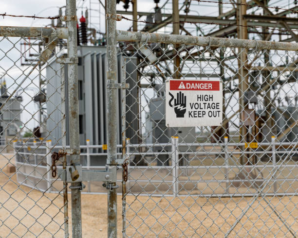 istock High voltage warning sign on locked gate at electrical substation 1153131041