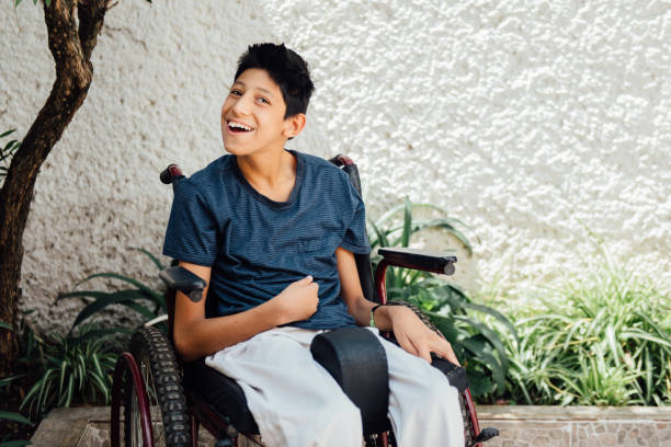 Portrait of teenager boy with Cerebral Palsy on wheelchair